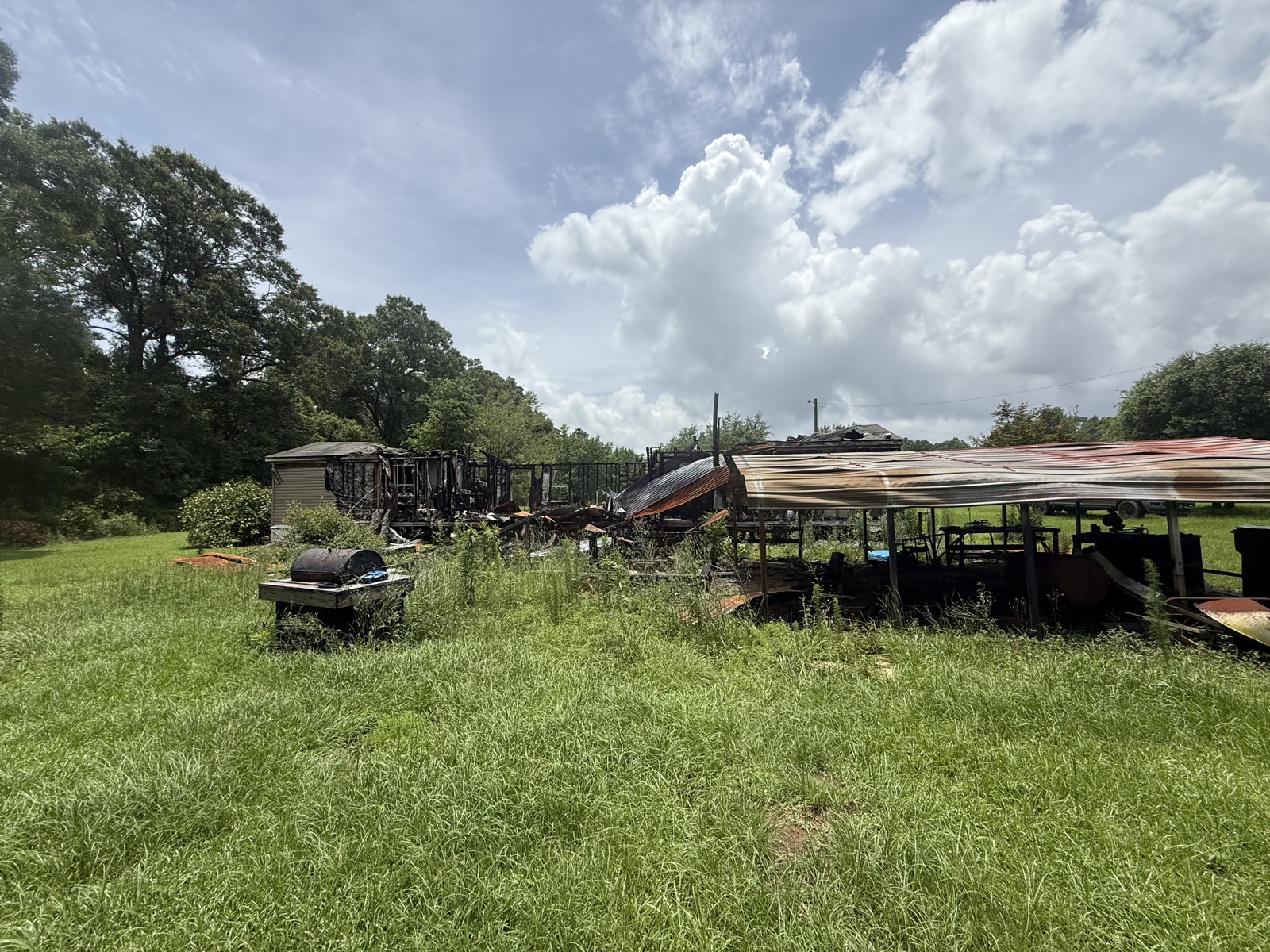 Fire-damaged structure before cleanup and removal